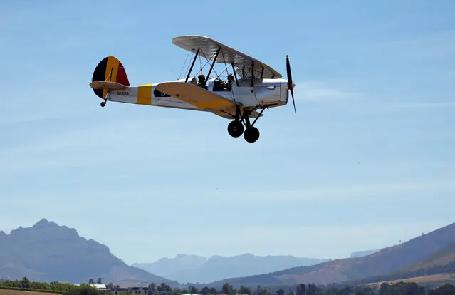 A biplane taking part in the Vintage Air Rally lands, in Stellenbosch, near Cape Town, South Africa December 16, 2016. (Photo by Mike Hutchings/Reuters)