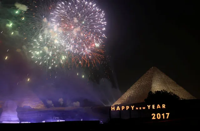 Fireworks explode above the pyramids during New Year's day celebrations on the outskirts of Cairo, Egypt, January 1, 2017. (Photo by Mohamed Abd El Ghany/Reuters)