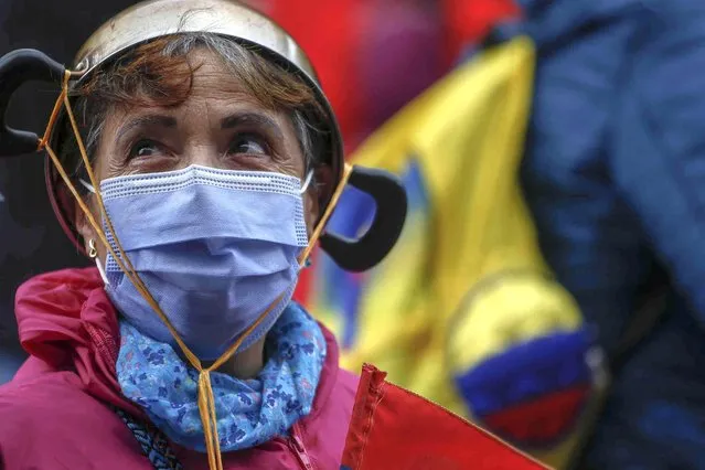 A woman takes part in an anti-government protest in Bogota, Colombia, Tuesday, July 20, 2021, as the county marks its Independence Day. (Photo by Ivan Valencia/AP Photo)