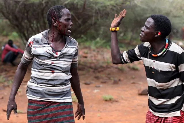 Two men fight over a dispute during an initiation ceremony for young men in Baringo County, Kenya, January 20, 2016. (Photo by Siegfried Modola/Reuters)