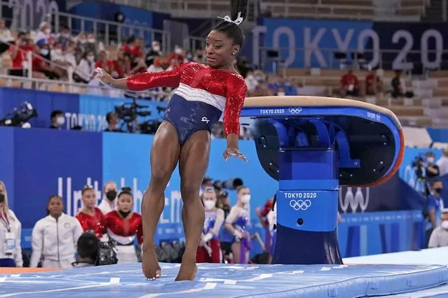 Simone Biles, of the United States, lands from the vault during the artistic gymnastics women's final at the 2020 Summer Olympics, Tuesday, July 27, 2021, in Tokyo. (Photo by Gregory Bull/AP Photo)