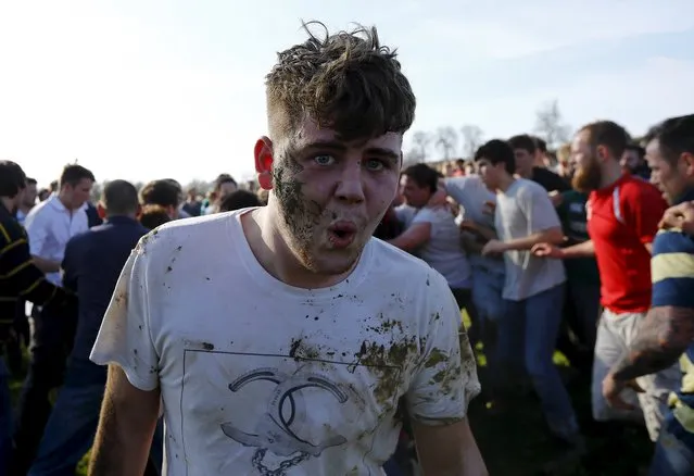 A player reacts as he leaves the scrum during the bottle-kicking game in Hallaton, central England April 6, 2015. (Photo by Darren Staples/Reuters)