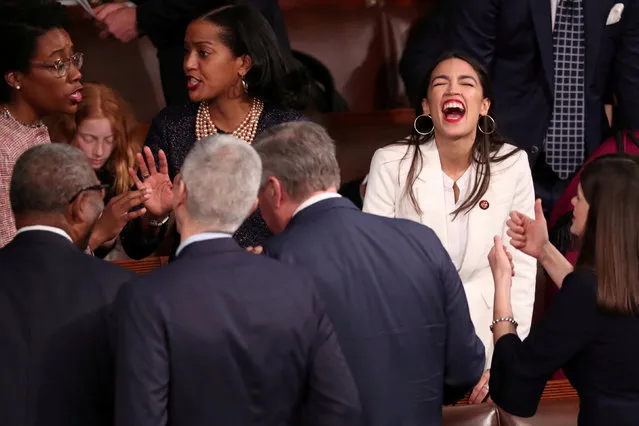 U.S. Representative-elect Alexandria Ocasio-Cortez (D-NY) reacts inside the House Chamber as the U.S. House of Representatives meets for the start of the 116th Congress on Capitol Hill in Washington, U.S., January 3, 2019. (Photo by Jonathan Ernst/Reuters)