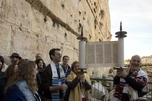 In this photo taken Thursday, February 25, 2016, American Reform Rabbi, Zachary Shapiro, center left, and other American and Israeli Reform rabbis pray in the Western Wall, the holiest site where Jews can pray in Jerusalem's old city. (Photo by Sebastian Scheiner/AP Photo)