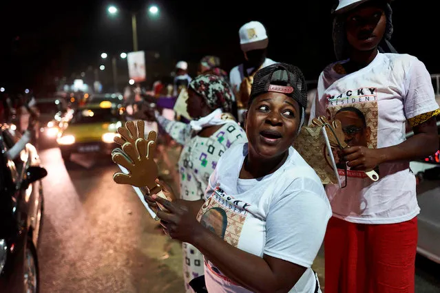 Supporters of outgoing president Macky Sall celebrate in advance their candidate's victory at the Senegal's presidential elections on February 24, 2019 in Dakar. Macky Sall, a stolid 56-year-old ex-geologist who challenged his former mentor to become president, won in the first round of the election on February 24, his prime minister said, although his two main challengers look set to contest the outcome. (Photo by Michele Cattani/AFP Photo)