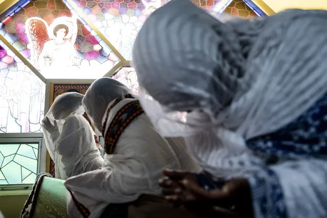 Members of the Ethiopian community take part in a special prayer for the victims of the Ethiopian Airlines flight ET302 crash, at the Ethiopian Orthodox Tewahedo Church of Canada Saint Mary Cathedral in Toronto, on Sunday, March 10, 2019. Ethiopian Airlines flight ET302 crashed shortly after takeoff from Ethiopia's capital on Sunday morning, killing all on board, authorities said, including 18 Canadians. (Photo by Christopher Katsarov/The Canadian Press via AP Photo)