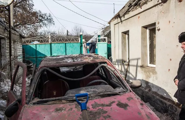 A car that was destroyed when a grad rocket, one of many that hit the same part of town, fell earlier around 7:30 in the morning, on February 1, 2017 in Avdiivka, Ukraine. The conflict with Russia-backed rebels has intensified dramatically in the front-line town over the past several days, leaving residents without heat or electricity in frigid temperatures. (Photo by Brendan Hoffman/Getty Images)