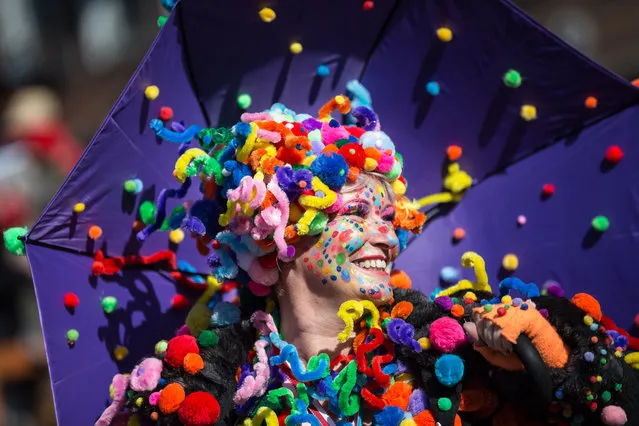A woman in costume takes part in the re-scheduled Rosenmontag carnival parade in Duesseldorf, Germany, March 13, 2016. The traditional Rosenmontag carnival parade was originally canceled because of storm warnings. (Photo by Maja Hitij/EPA)