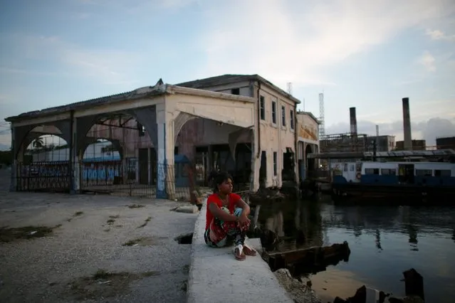 Merced Godoy, 17, rests by the sea in Regla, Cuba, March 17, 2016. (Photo by Alexandre Meneghini/Reuters)