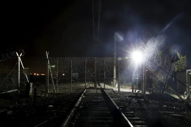 A view of the closed gate for railway passage at Greek-Macedonian border fence near the village of Idomeni, Greece March 16, 2016. (Photo by Alkis Konstantinidis/Reuters)