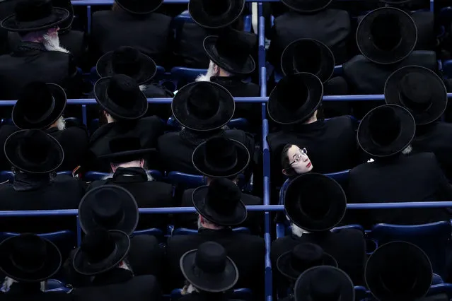 Thousands of ultra-Orthodox Jews gather at Arthur Ashe Stadium to raise donations for educational institutions in Israel, in Queens neighborhood in New York, United States on April 12, 2019. The ultra-Orthodox group does not believe in the State of Israel. (Photo by Atilgan Ozdil/Anadolu Agency/Getty Images)