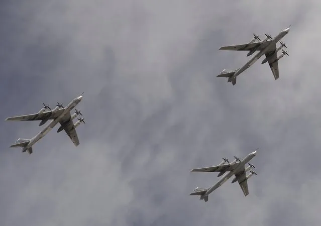 Tupolev Tu-95MS Bear strategic bombers fly in formation over the Red Square during the Victory Day parade in Moscow, Russia, May 9, 2015. (Photo by Reuters/Host Photo Agency/RIA Novosti)