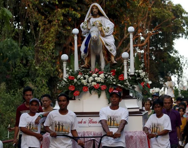 A statue of Jesus Christ on a carriage is pictured during a religious procession for Holy Week in Boac, Marinduque in central Philippines March 23, 2016. (Photo by Erik De Castro/Reuters)