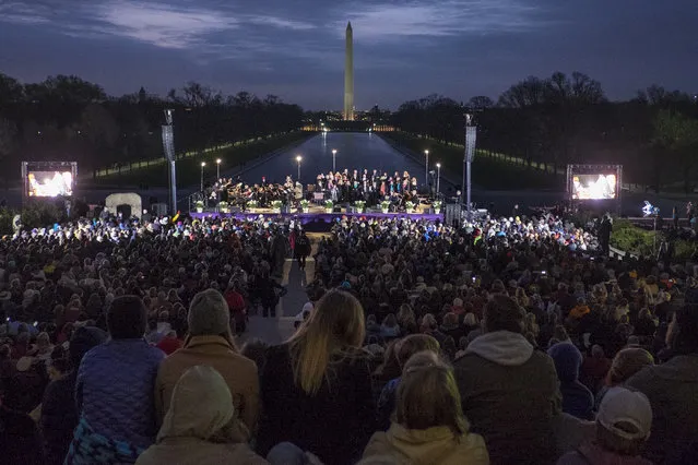 Thousands of Christian faithful gather to celebrate the resurrection during the 38th Annual Easter Sunrise Service at the Lincoln Memorial on Sunday, March 27, 2016 in Washington, District of Columbia. Christians huddled in the cool weather before dawn on the steps of the Lincoln Memorial for the service sponsored by Capital Church of Vienna, Va. (Photo by Pete Marovich/The Washington Post)