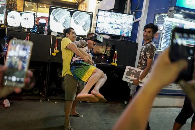 Tourist play on a street near Patong beach in Phuket, Thailand March 19, 2016. (Photo by Athit Perawongmetha/Reuters)