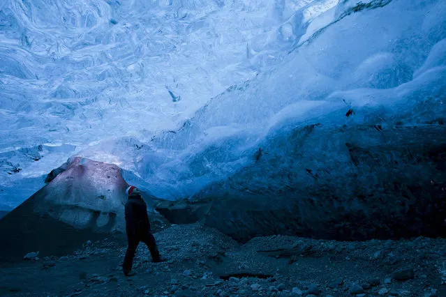 A view of Rob Lott standing in the crystal ice cave in the Vatnajokull Glacier, Iceland. (Photo by Rob Lott/Barcroft Media)