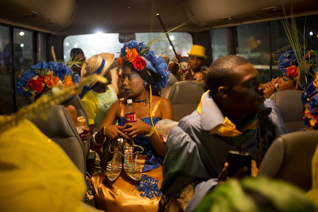 A queen and other performers sit in a bus after in performing in Carnival celebrations in Les Cayes, Haiti. Tuesday, February 28, 2017. Les Cayes Mayor Jean Gabriel Fortune said he was grateful for the chance to host Carnival, describing it as a “gesture of solidarity”. (Photo by Dieu Nalio Chery/AP Photo)