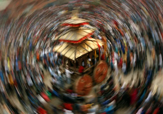 The chariot of God Bhairab is pulled through the city centre of Bhaktapur during the Bisket festival in Nepal, April 13, 2016. (Photo by Navesh Chitrakar/Reuters)