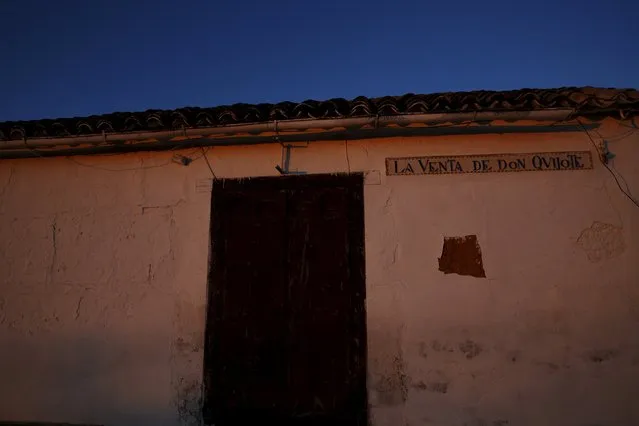 The morning sun illuminates an old inn named after Don Quixote in the outskirts of El Toboso, Spain, April 7, 2016. (Photo by Susana Vera/Reuters)