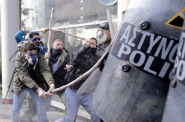 Farmers with shepherds crooks clash with riot policemen during a protest outside the Greek Agriculture Ministry on March 8, 2017 in Athens, Greece. (Photo by Milos Bicanski/Getty Images)