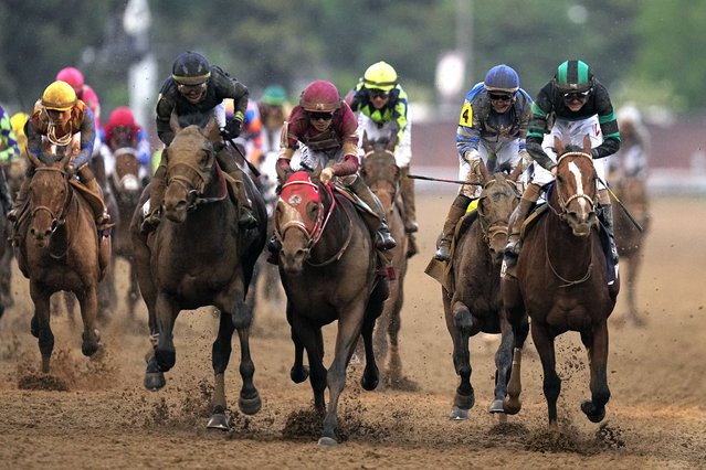 Brian Hernandez Jr. rides Mystik Dan, right, to the finish line to win the 150th running of the Kentucky Derby horse race at Churchill Downs Saturday, May 4, 2024, in Louisville, Ky. (Photo by Brynn Anderson/AP Photo)