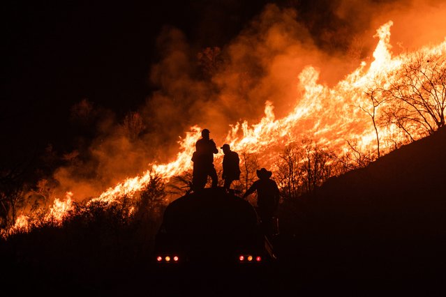 Residents work to contain wildfires in Nogales, in the High Mountains area of Veracruz state, Mexico, late Monday, March 25, 2024. (Photo by Felix Marquez/AP Photo)