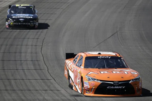 Daniel Suarez (18) drives during the NASCAR Xfinity series auto race at Chicagoland Speedway, Sunday, June 21, 2015, in Joliet, Ill. (AP Photo/Nam Y. Huh) 