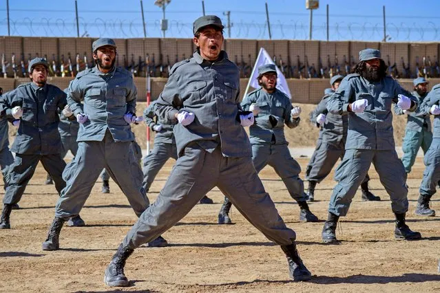 Newly recruited Taliban fighters display their skills during a graduation ceremony at the Abu Dujana National Police Training centre in Kandahar on February 9, 2022. (Photo by Javed Tanveer/AFP Photo)