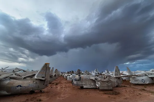 The infamous boneyard seen against a summer monsoon sky in Tucson, Arizona in July 2012. (Photo by Mike Olbinski/Barcroft Media)