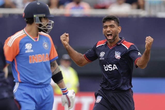 United States' Saurabh Nethralvakar, right, celebrates the dismissal of India's Virat Kohli, left, during the ICC Men's T20 World Cup cricket match between United States and India at the Nassau County International Cricket Stadium in Westbury, New York, Wednesday, June 12, 2024. (Photo by Adam Hunger/AP Photo)