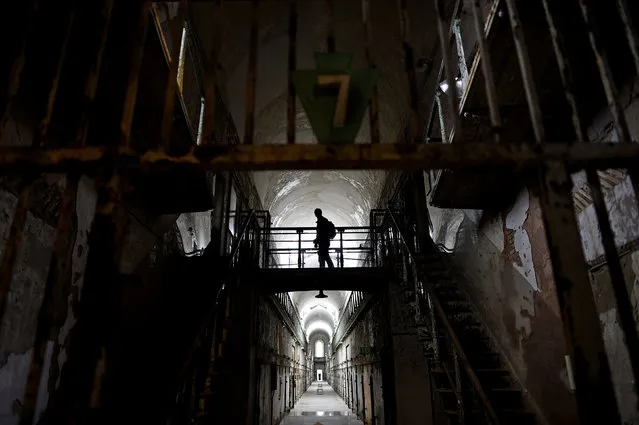A visitor wanders through block 7 of Eastern State Penitentiary in Philadelphia, Pennsylvania April 30, 2014. (Photo by Mark Makela/Reuters)