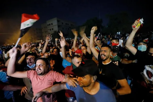 Demonstrators gather at a protest during a curfew, two days after the nationwide anti-government protests turned violent, in Baghdad, Iraq on October 3, 2019. (Photo by Thaier al-Sudani/Reuters)