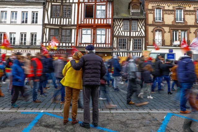 An elderly couple stand by a demonstration against French government's pension reform plan in as part of the national strike and protests in Pont-Audemer, France on March 7, 2023. (Photo by Gonzalo Fuentes/Reuters)