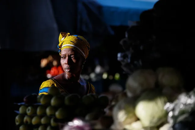  A woman is seen at a fruit market in Abidjan, Ivory Coast on August 10, 2019. Due to its geographical location, about one fifth of the Ivory Coast population lives in Abidjan which is adjacent to Burkina Faso, Ghana, Guinea, Liberia and Mali. Abidjan, which is also the center of the economy, is the most vivid city in the country. The markets in the city receive visits by many. Adjeme Market, which means “intersection” or “center” in the local Tchaman language, is open 24/7 and is considered the most important trade center of Central West Africa. The Ivory people, as well as those from neighboring countries, continue their business here. (Photo by Mahmut Serdar Alakus/Anadolu Agency via Getty Images)