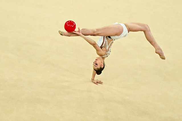 Bulgaria's Boryana Kaleyn performs with the ball in the rhytmic gymnastics' individual all-around qualification during the Paris 2024 Olympic Games at the Porte de la Chapelle Arena in Paris, on August 8, 2024. (Photo by Gabriel Bouys/AFP Photo)