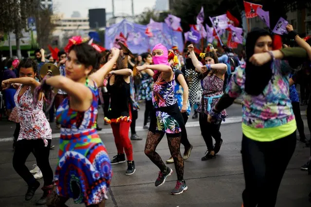 Demonstrators dance during a rally held to support women's rights to an abortion in Santiago, Chile, July 25, 2015. (Photo by Ivan Alvarado/Reuters)