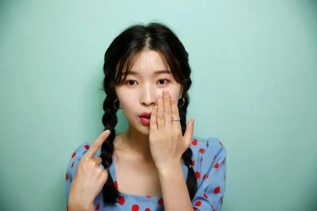 Kang Na-ra, a North Korean defector who is now a beauty YouTuber, points at her lips after putting on a lipstick made by North Korea, in Seoul, South Korea, June 11, 2019. (Photo by Kim Hong-Ji/Reuters)
