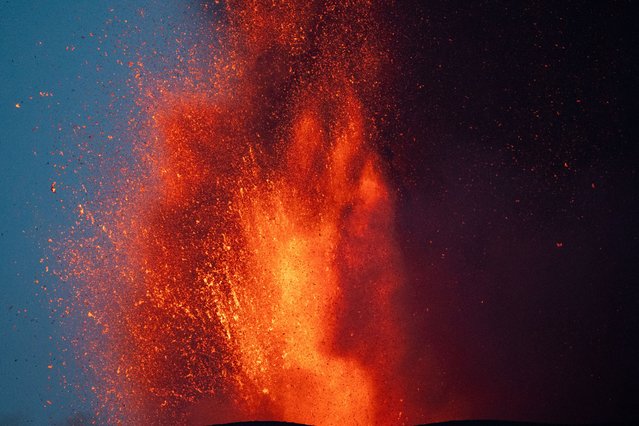 Lava rises from a crater of Mount Etna, Europe's most active volcano, Italy on July 7, 2024. (Photo by Giuseppe Di Stefano/Etna Walk via Reuters)