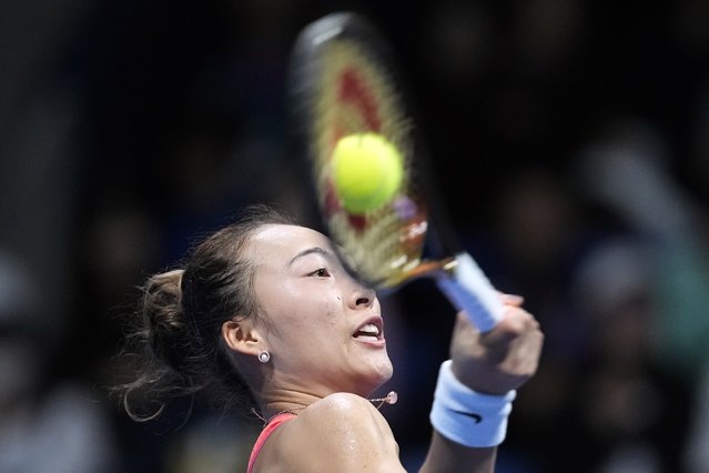 China's Zheng Qinwen returns a shot against Sofia Kenin of the United States during the final match of the Pan Pacific Open women's tennis tournament at Ariake Coliseum, in Tokyo, Sunday, October 27, 2024. (Photo by Eugene Hoshiko/AP Photo)