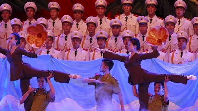 People perform during celebrations to commemorate the 70th anniversary of the establishment of the Vietnam Public Security police force at the National Convention Center in Hanoi August 18, 2015. (Photo by Reuters/Kham)