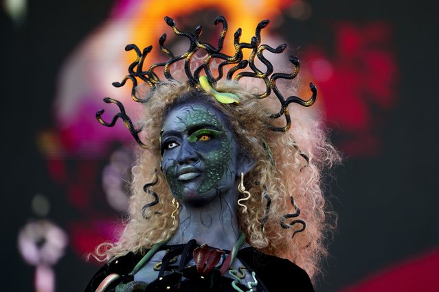 A model wear a Halloween themed costume during a parade at the West Side Hallo Fest, a Halloween festival in Bucharest, Romania, Saturday, October 26, 2024. (Photo by Andreea Alexandru/AP Photo)