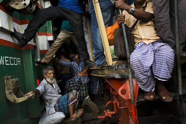 Bangladeshi Muslims travel on an overcrowded train as they head to their hometowns ahead of Eid al-Adha in Dhaka, Bangladesh, Friday, September 1, 2017. (Photo by Bernat Armangue/AP Photo)