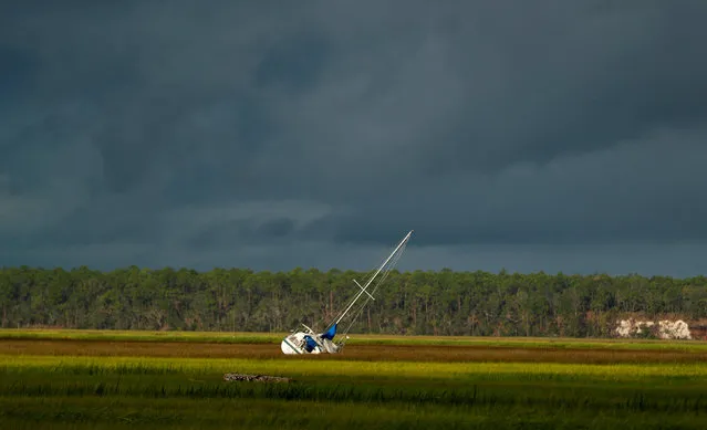 A boat is seen after being blown from the dock into the marsh after Hurricane Irma passed through in St Marys, Georgia, U.S., September 12, 2017. (Photo by Chris Keane/Reuters)