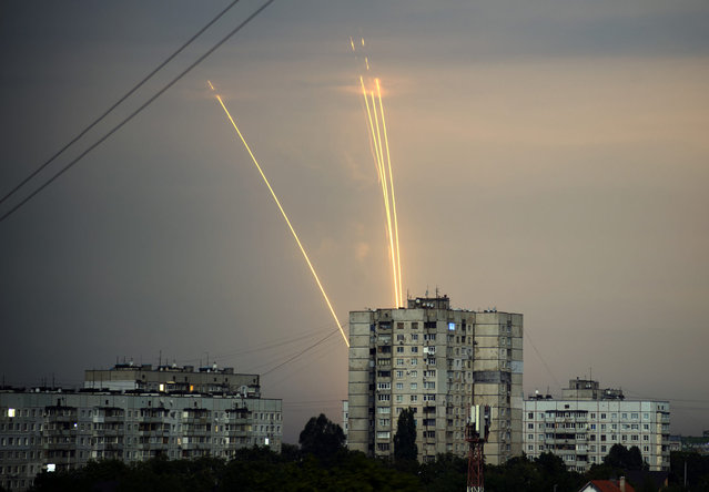 Russian rockets launch against Ukraine from Russia's Belgorod region are seen at dawn in Kharkiv, Ukraine, Monday, August 15, 2022. (Photo by Vadim Belikov/AP Photo)