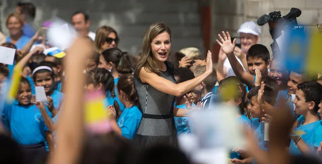 Spanish Queen Letizia is greeted by children at “San Matias” primary school during the inauguration of the school year in La Laguna, Spain September 19, 2017. (Photo by Santiago Ferrero/Reuters)