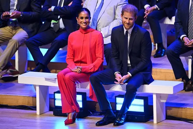 Britain's Meghan, Duchess of Sussex and Britain's Prince Harry, Duke of Sussex, react as they attend the annual One Young World Summit at Bridgewater Hall in Manchester, north-west England on September 5, 2022. The One Young World Summit is a global forum for young leaders, bringing together young people from over 190 countries around the world to come together to confront the biggest challenges facing humanity. (Photo by Oli Scarff/AFP Photo)