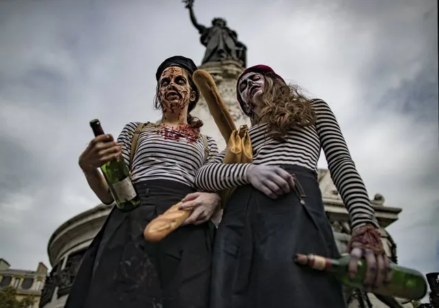Participants in costume take part in a walk for World Zombie Day 2017, on Place de la Republique in Paris, France, 07 October 2017. (Photo by Ian Langsdon/EPA/EFE)