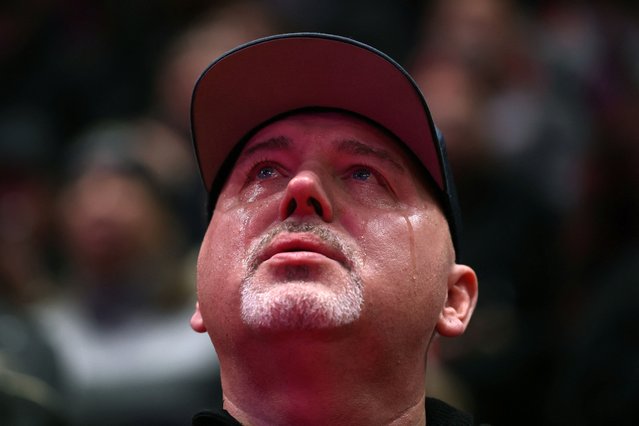 An attendee cries inside Capital One arena on inauguration day on January 20, 2025. (Photo by Amanda Perobelli/Reuters)