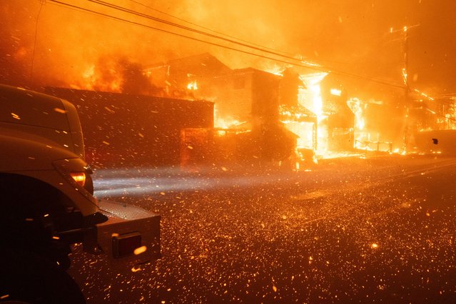 Embers fly in high winds as firefighters battle winds and flames as multiple beachfront homes go up in flames along Pacific Coast Highway in Malibu in the Palisades Fire on Tuesday, January 7, 2025 (Photo by David Crane/MediaNews Group/Los Angeles Daily News via Getty Images)
