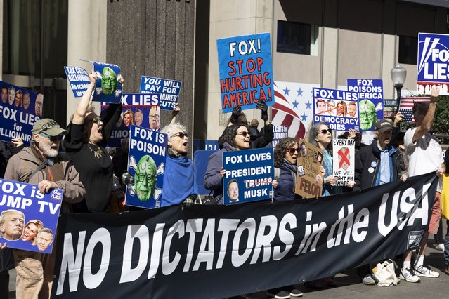 Protesters chant and brandish signs outside the headquarters of News Corp, the owner of Fox News, in Manhattan, New York, US on March 18, 2025. (Photo by Gina M. Randazzo/Zuma Press Wire/Rex Features/Shutterstock)